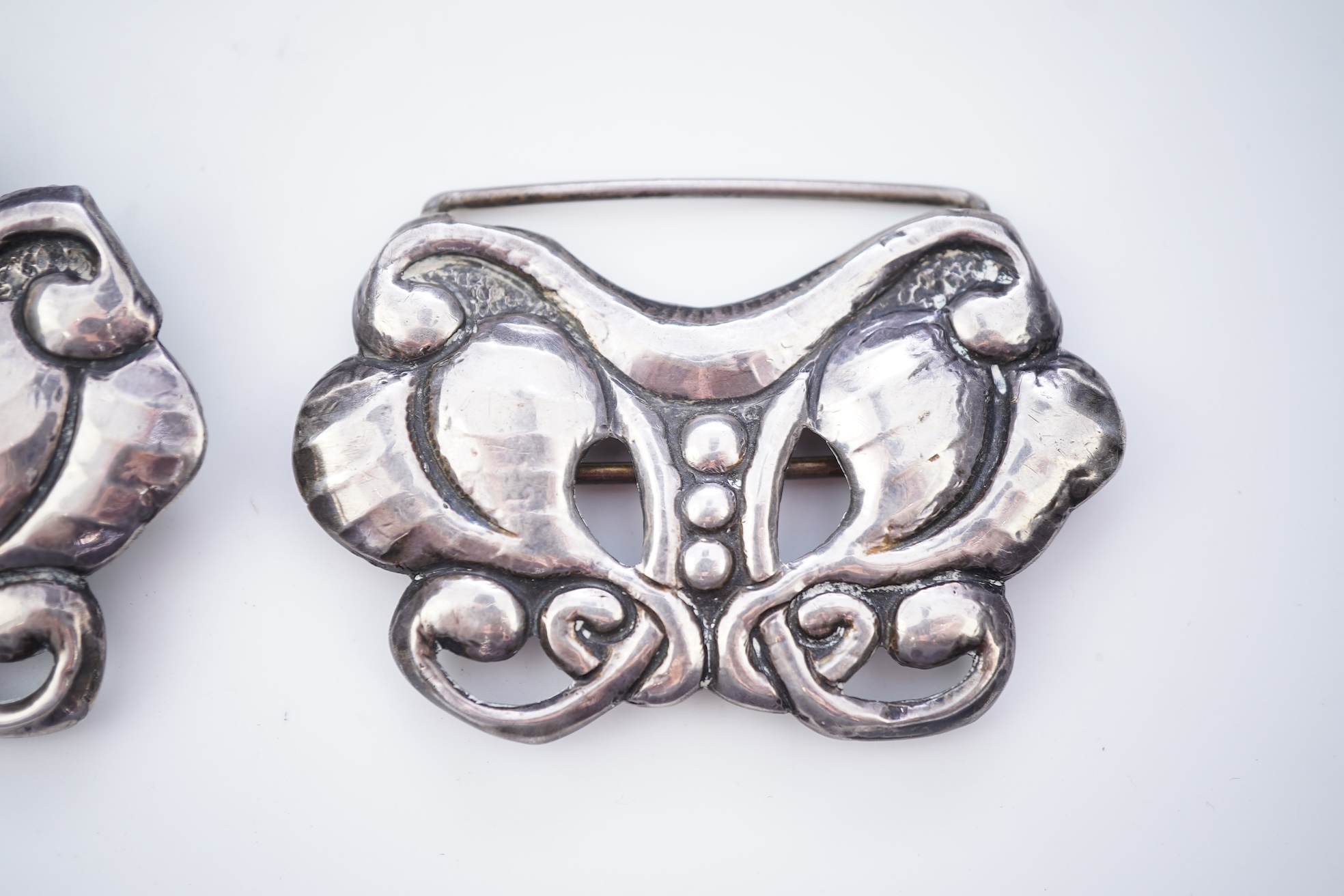 An Arts & Crafts silver and amber buckle, Denmark, early-mid 20th century